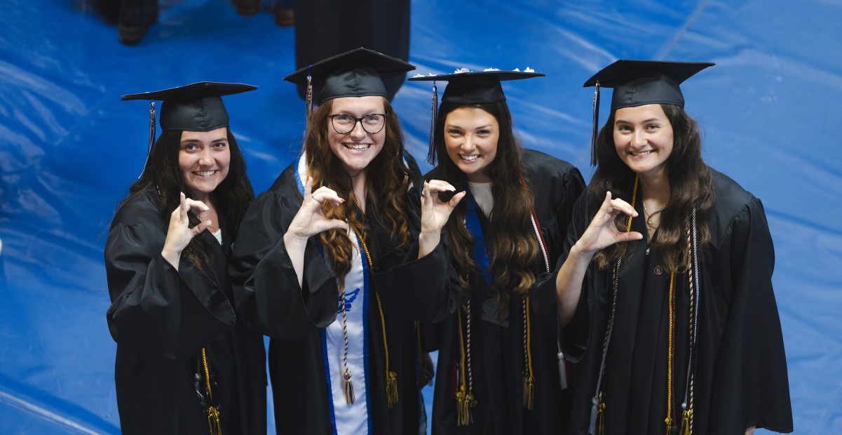 IC students posing at graduation