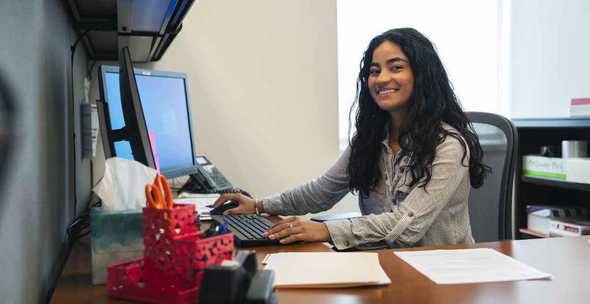 Nicole Guzman sitting at a computer