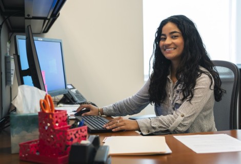 Nicole Guzman sitting at a computer